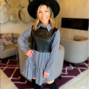 Adorable black and white check dress with faux leather bodice.
